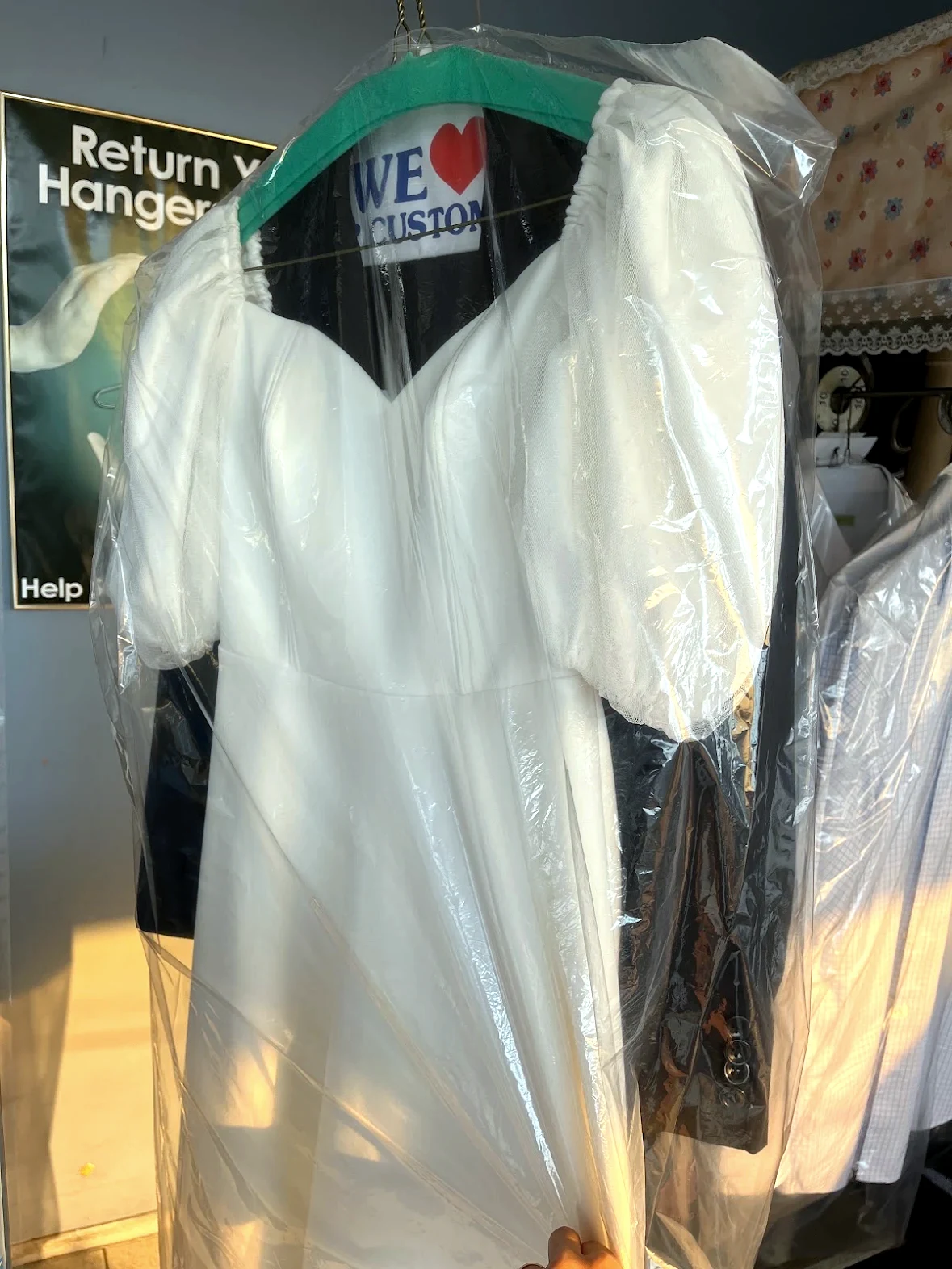 White dress professionally cleaned and prepared at Royal Oak Drycleaners