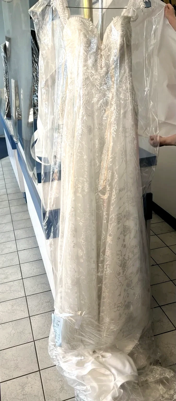Multiple wedding gowns prepared after cleaning